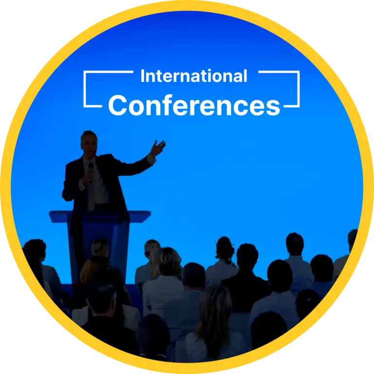 Speaker addressing students during an international conference, showcasing global exposure opportunities at top MBA colleges in Ahmedabad Gujarat.
